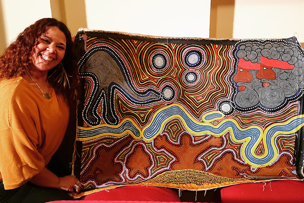 Kat Clarke with a painting by Thomas Clarke